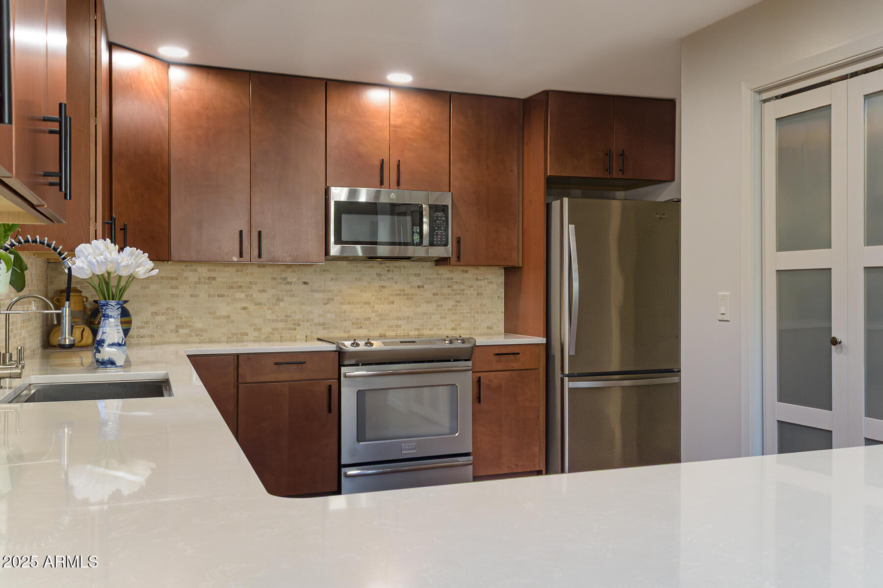 120 Indian Ruin Road Sedona, AZ 86351 - Photo 2 of 46 a kitchen with stainless steel appliances granite countertop a refrigerator sink and microwave