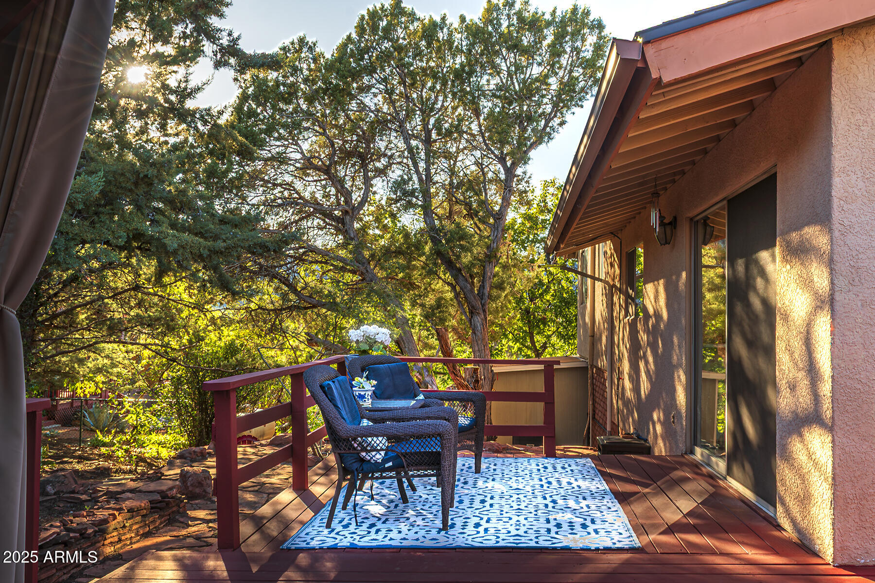 120 Indian Ruin Road Sedona, AZ 86351 - Photo 8 of 46 a backyard of a house with table and chairs