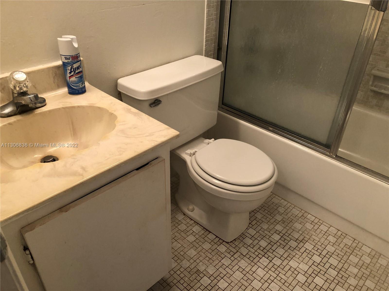 250 Gate Road, Unit 153 Hollywood, FL 33024 - Photo 13 of 19 a bathroom with a toilet and a sink