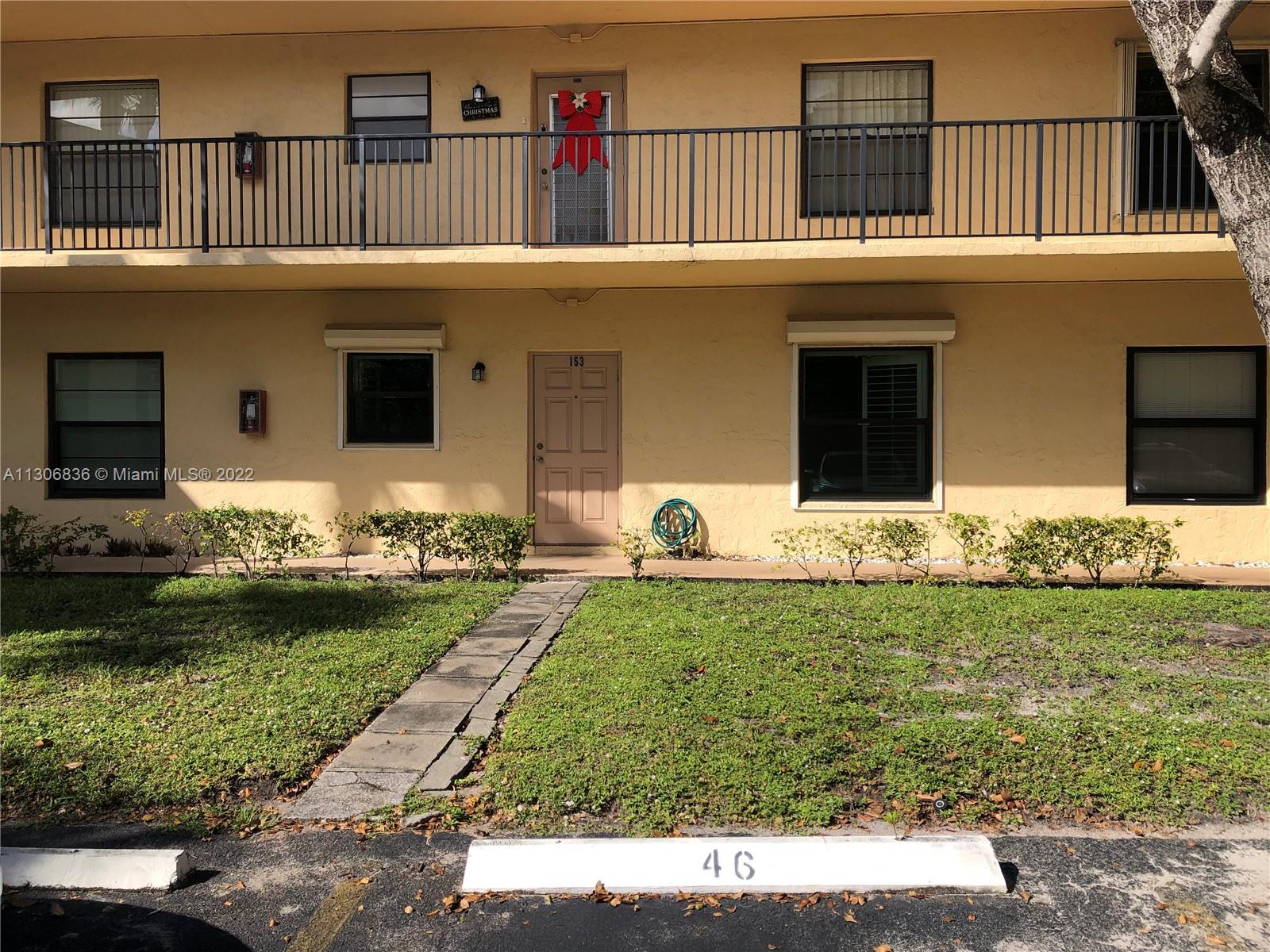 250 Gate Road, Unit 153 Hollywood, FL 33024 - Photo 2 of 19 a front view of house with yard