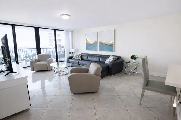 a living room with furniture and a large window