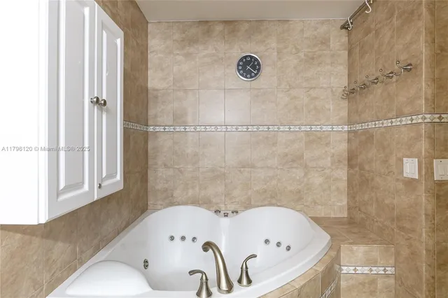 a bathroom with a tub and shower