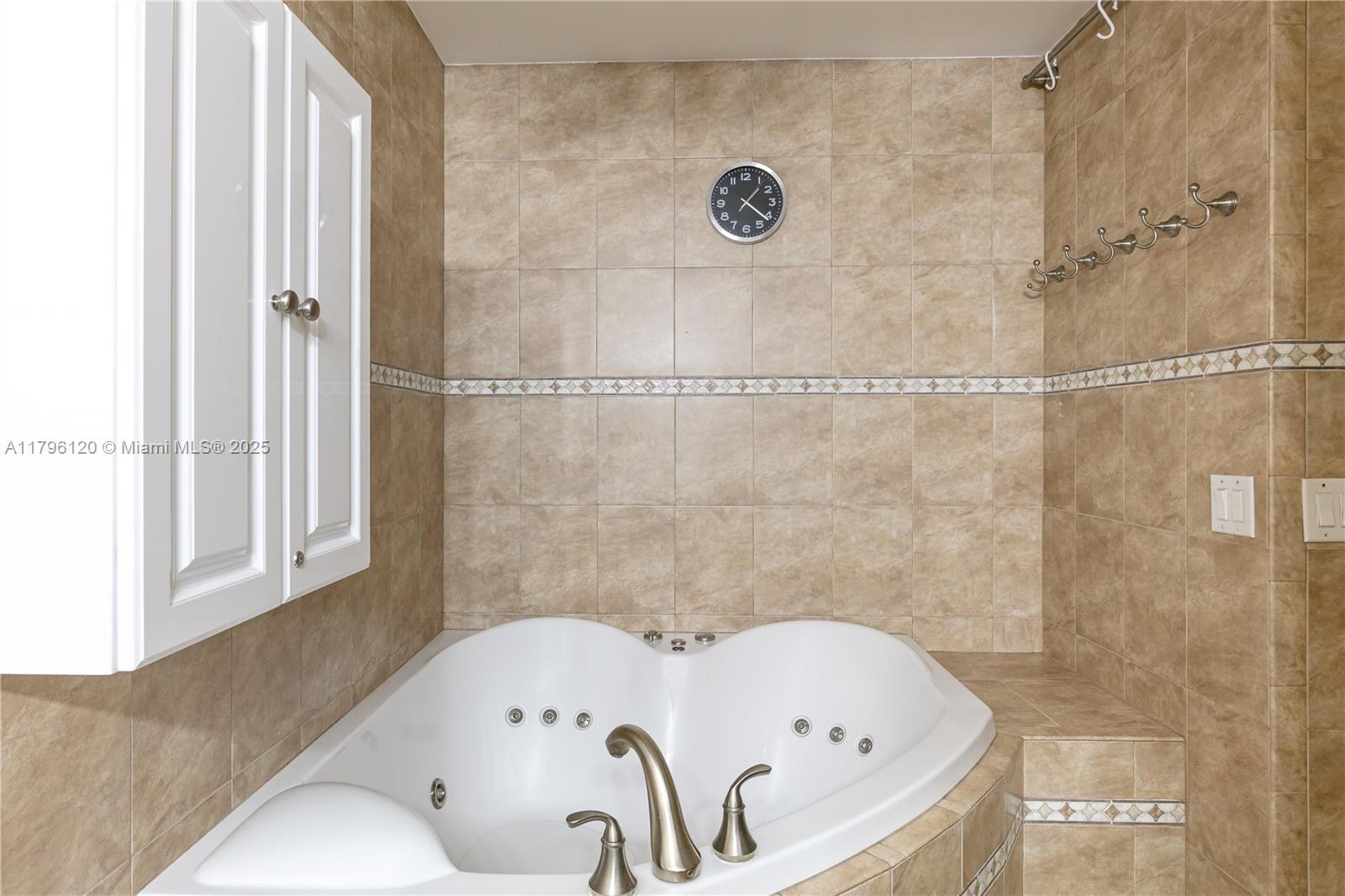 2101 South Ocean Drive, Unit 606 Hollywood, FL 33019 - Photo 13 of 58 a bathroom with a tub and shower