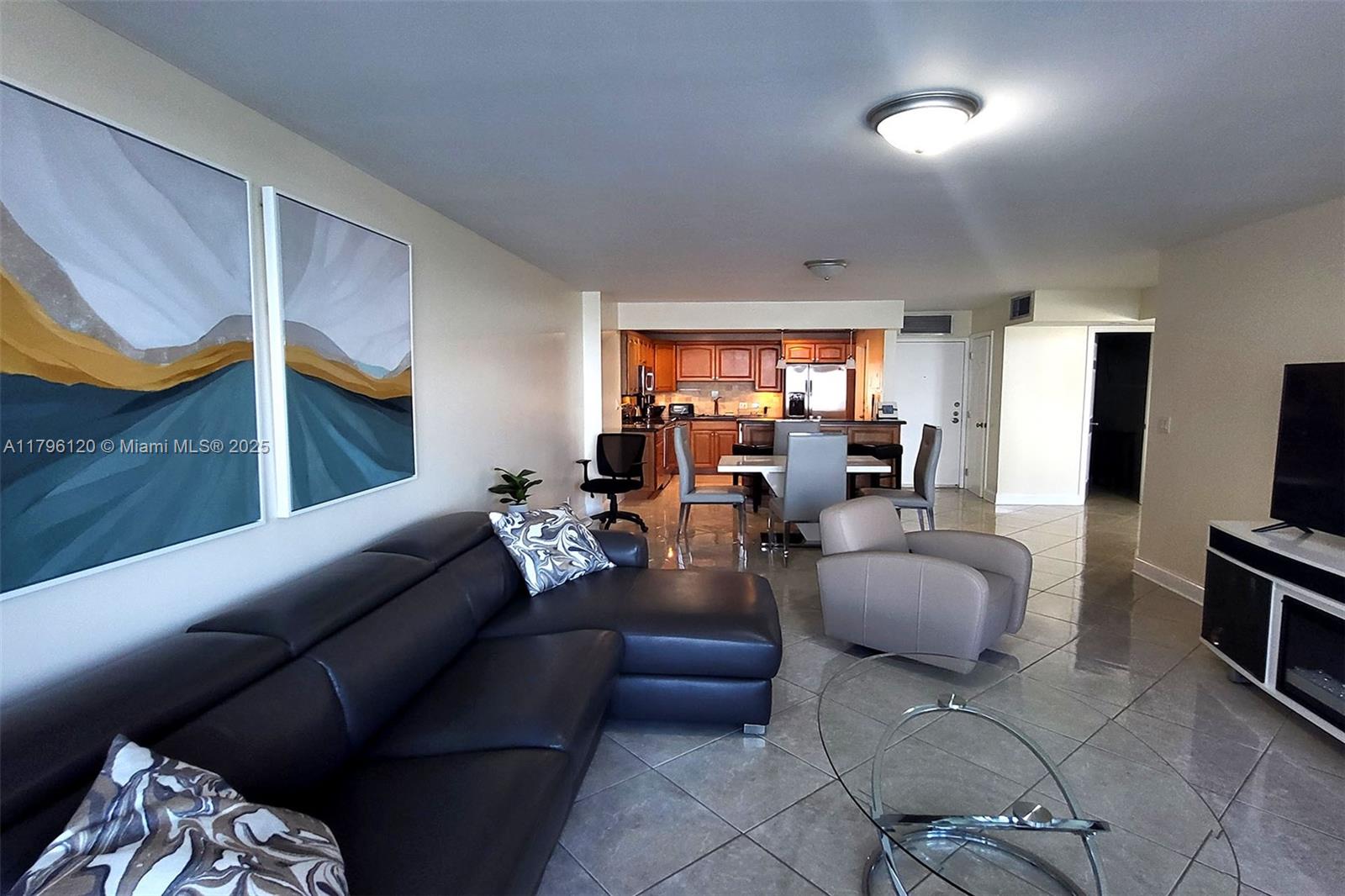 2101 South Ocean Drive, Unit 606 Hollywood, FL 33019 - Photo 7 of 58 a living room with furniture fireplace and flat screen tv