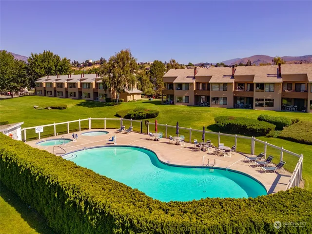 a view of a swimming pool with a garden