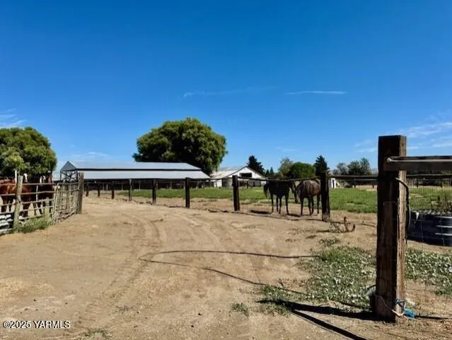 a view of house with yard