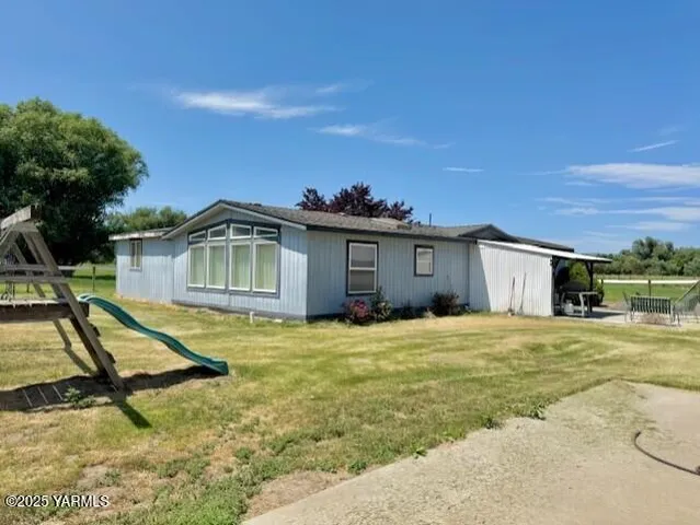 a house with trees in the background