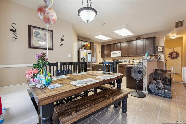 a view of a dining room with furniture and a table