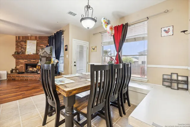 a kitchen with stainless steel appliances granite countertop a sink dishwasher stove top oven and refrigerator