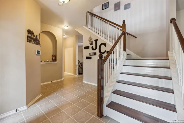 a view of a hallway with wooden walls