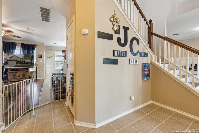 a bedroom with furniture and a wooden floor