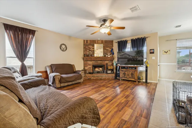 a living room with furniture and a fireplace