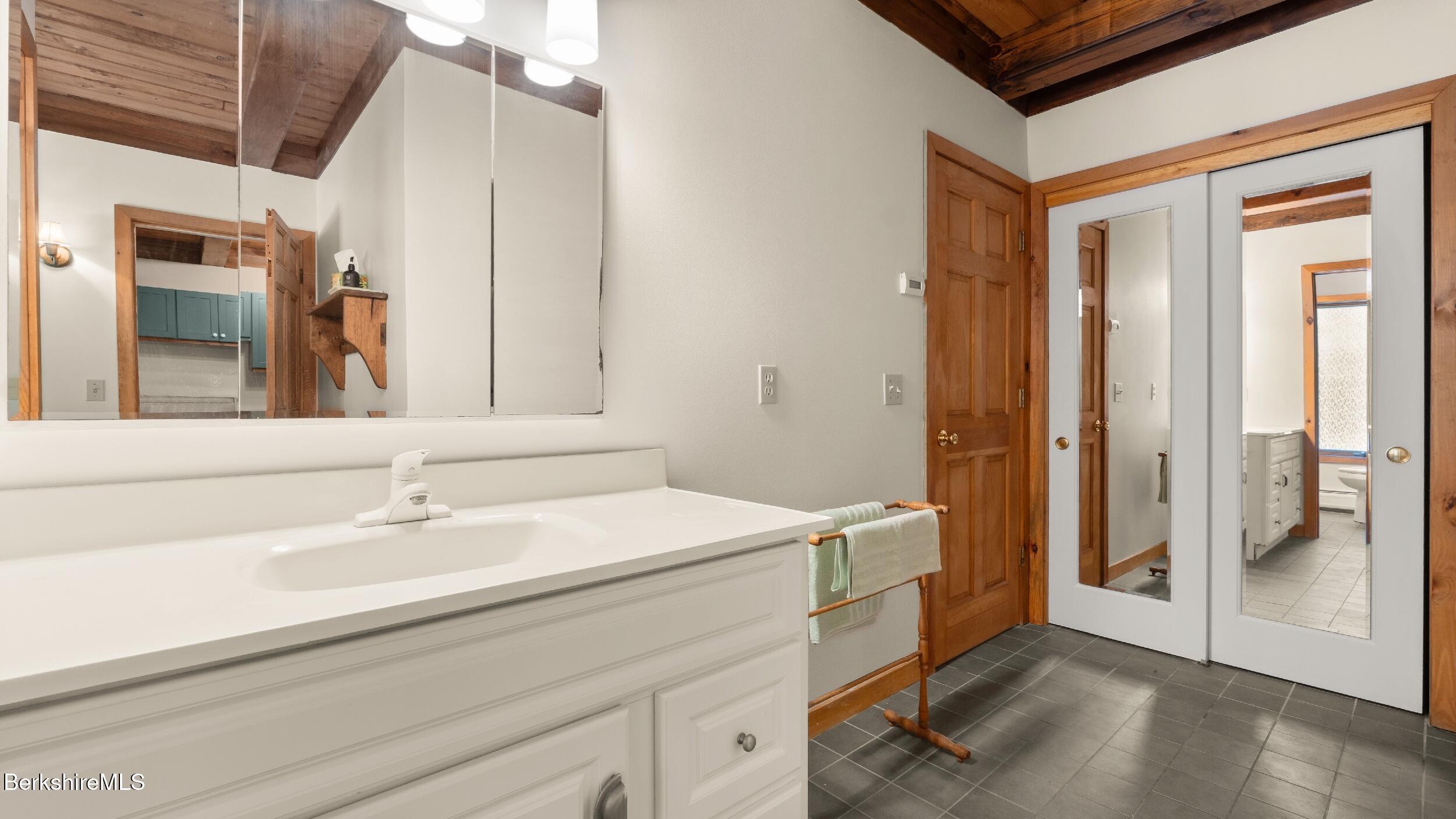 173 Hillsdale Road Egremont, MA 01230 - Photo 54 of 82 a bathroom with a sink a mirror and a shower