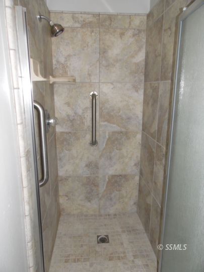 208 South Greenlawn Street Ridgecrest, CA 93555 - Photo 23 of 29 a close view of a bathroom shower