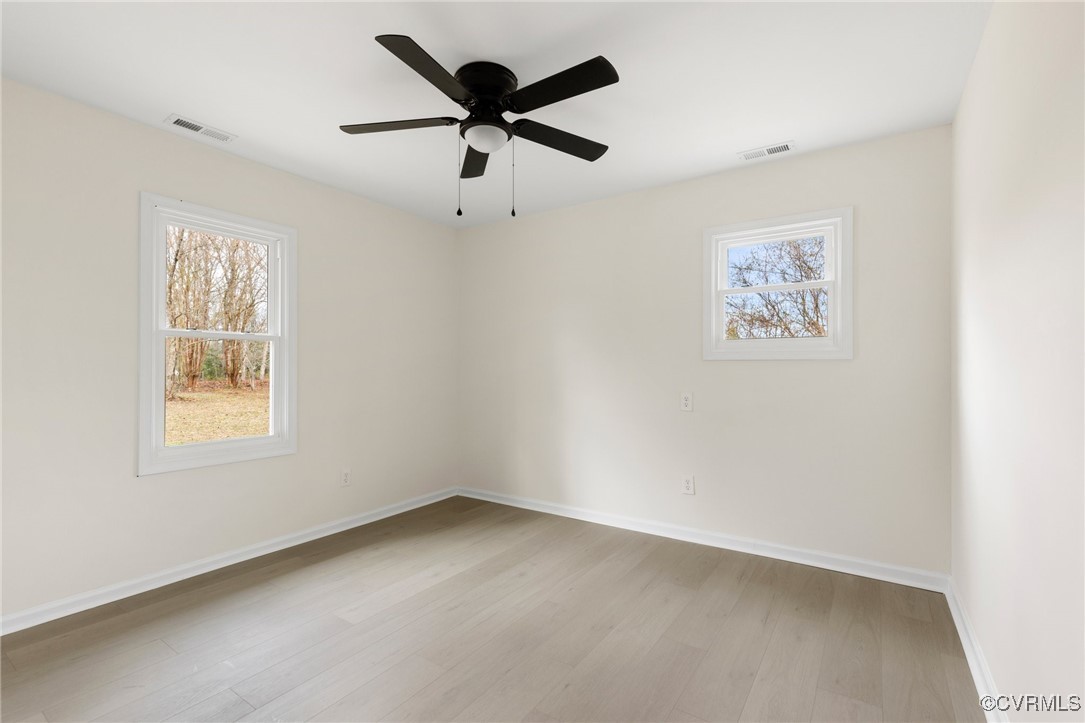1700 Globe Road Aylett, VA 23009 - Photo 19 of 24 an empty room with a window and a fan
