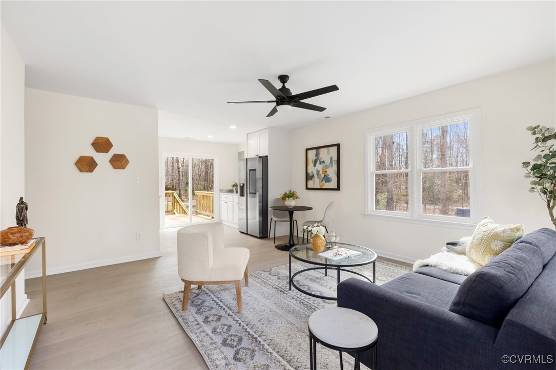 1700 Globe Road Aylett, VA 23009 - Photo 2 of 24 a living room with furniture and a large window