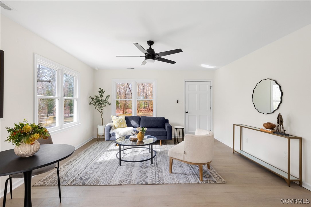 1700 Globe Road Aylett, VA 23009 - Photo 4 of 24 a living room with furniture a window and a potted plant