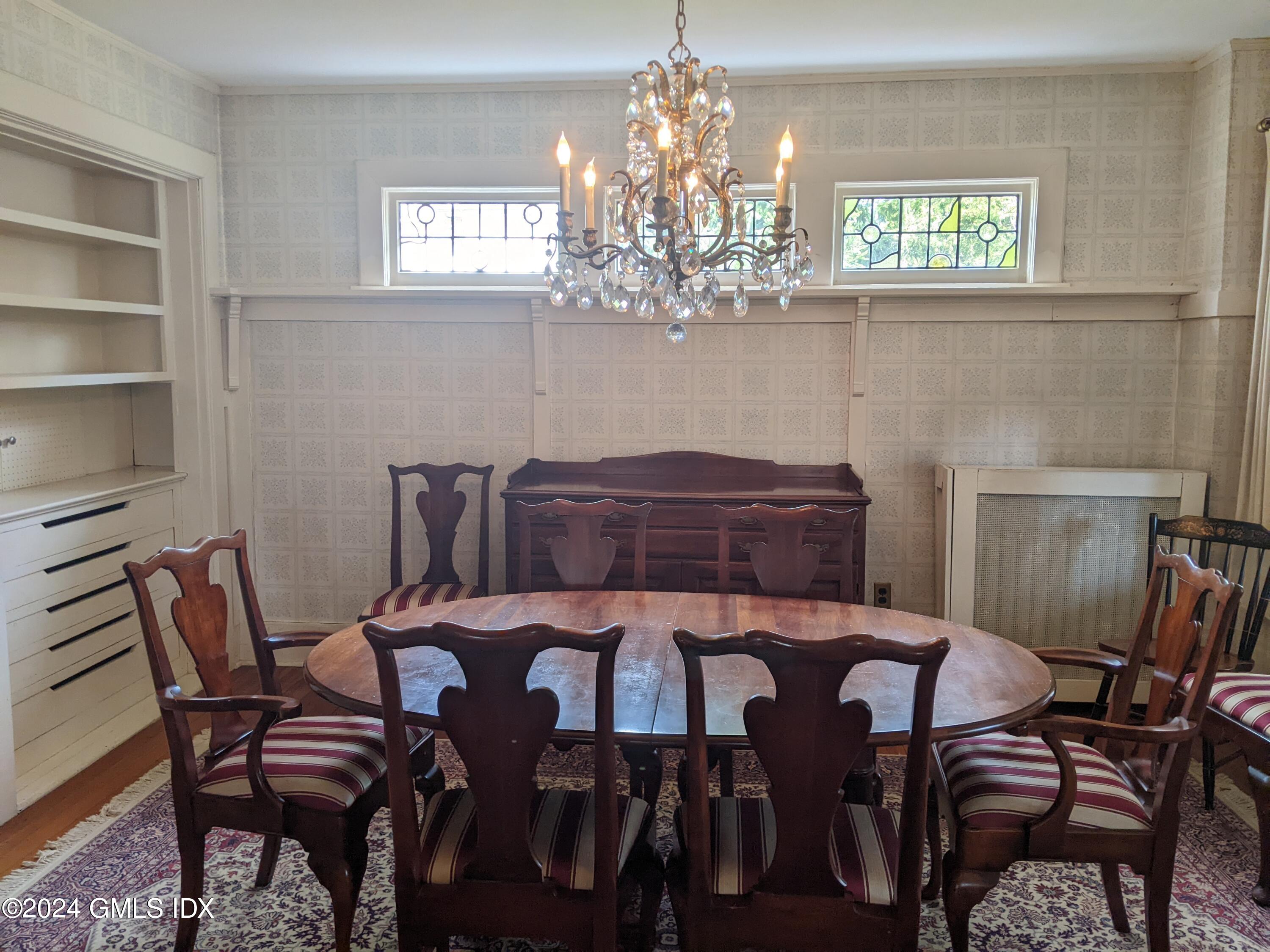 23 Ballwood Road Old Greenwich, CT 06870 - Photo 13 of 27 a view of a dining room with furniture and chandelier