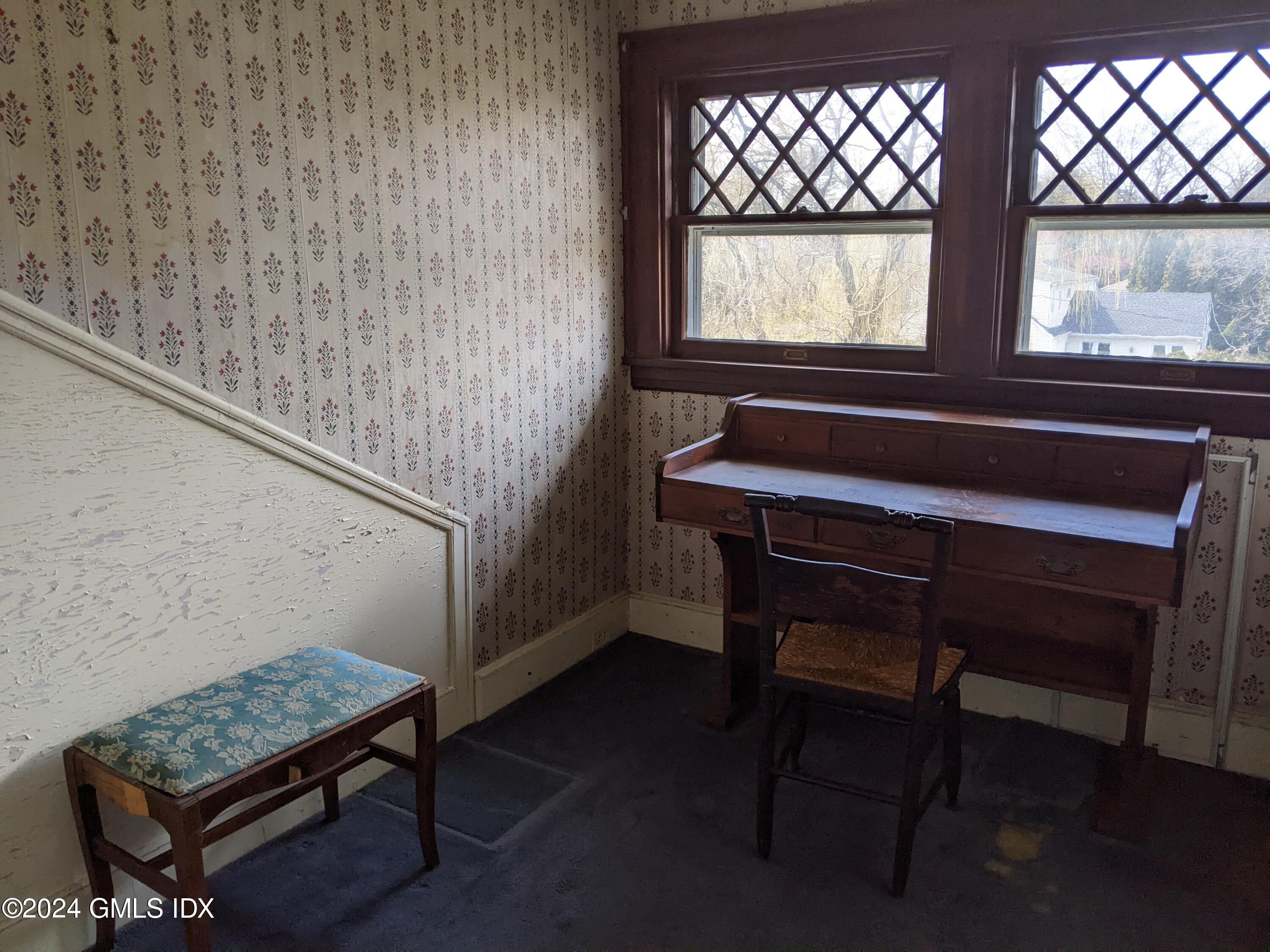 23 Ballwood Road Old Greenwich, CT 06870 - Photo 17 of 27 a room with a table chair and windows