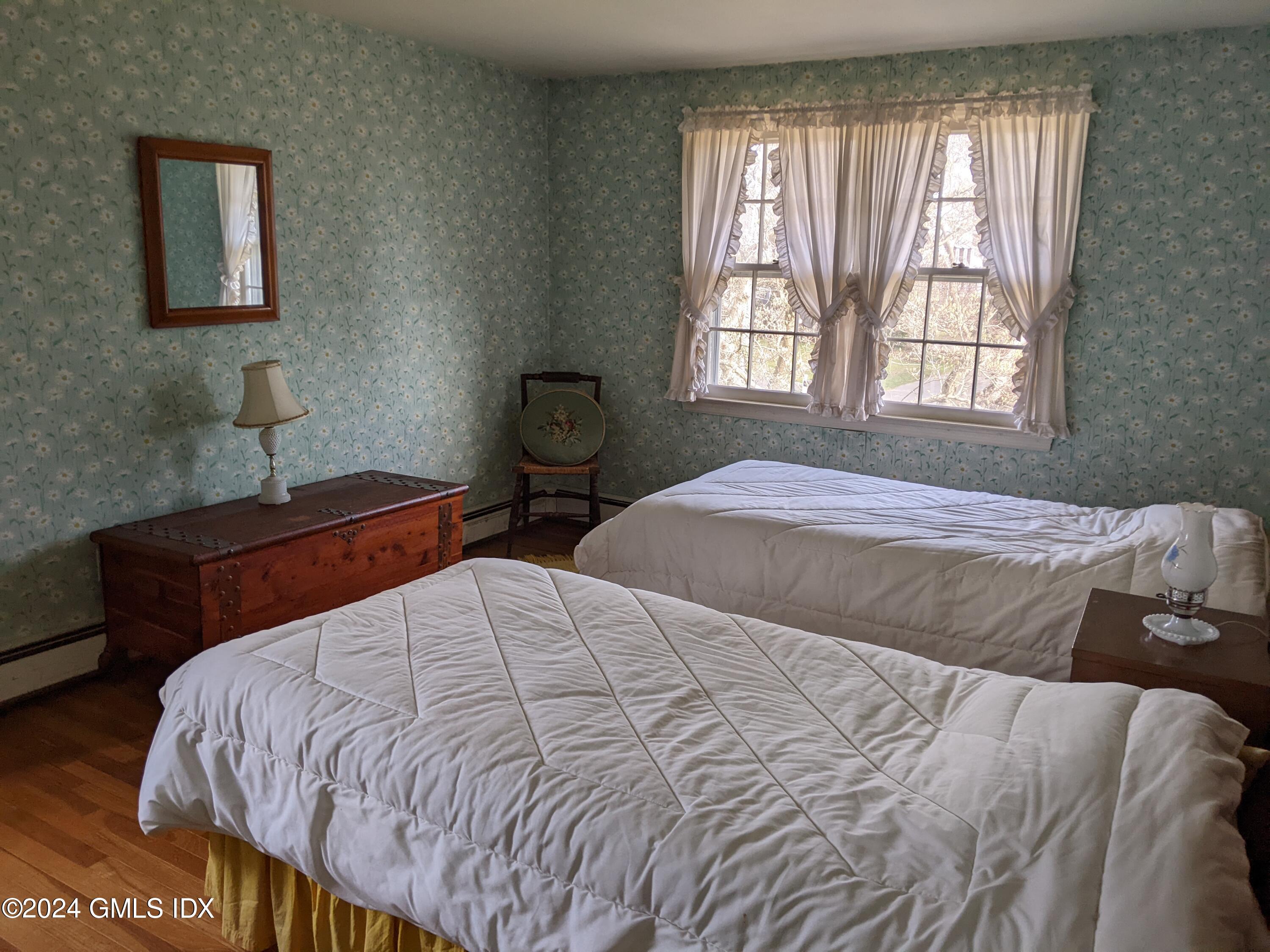 23 Ballwood Road Old Greenwich, CT 06870 - Photo 20 of 27 a bedroom with a bed and window