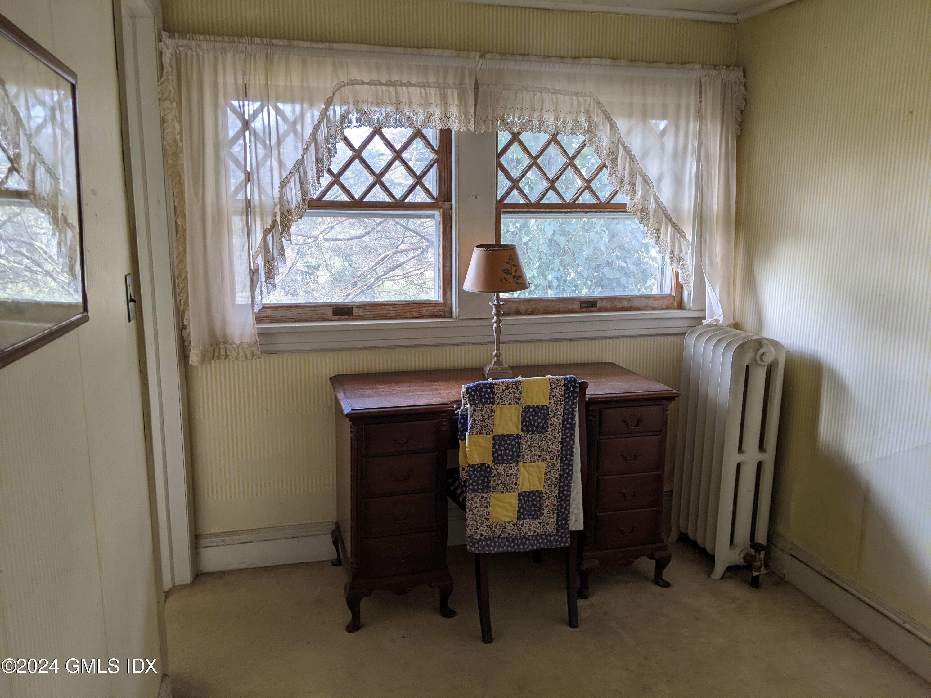 23 Ballwood Road Old Greenwich, CT 06870 - Photo 22 of 27 a view of a room with window and furniture
