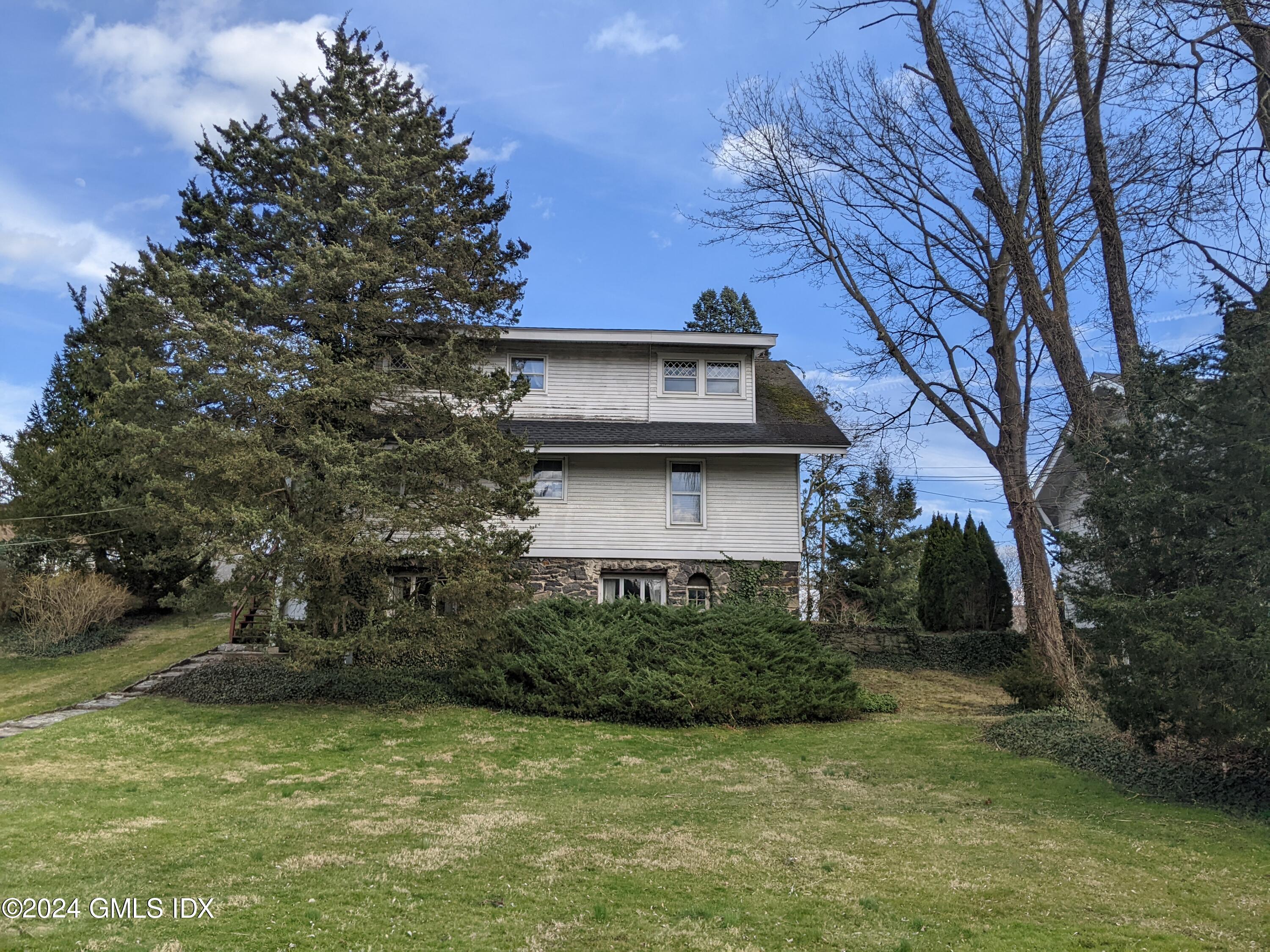 23 Ballwood Road Old Greenwich, CT 06870 - Photo 27 of 27 a view of a house with a yard
