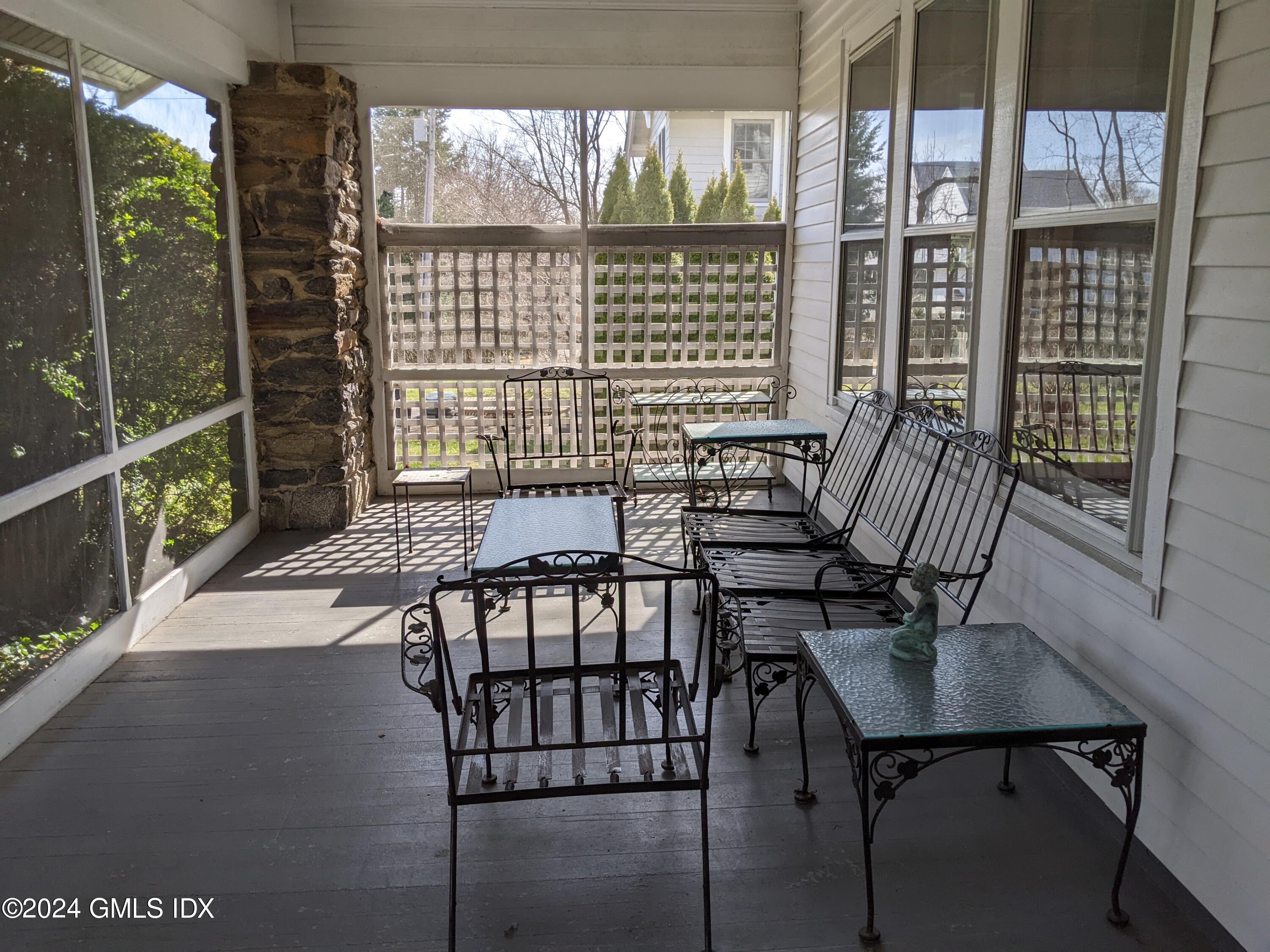 23 Ballwood Road Old Greenwich, CT 06870 - Photo 5 of 27 a view of a balcony and dining area