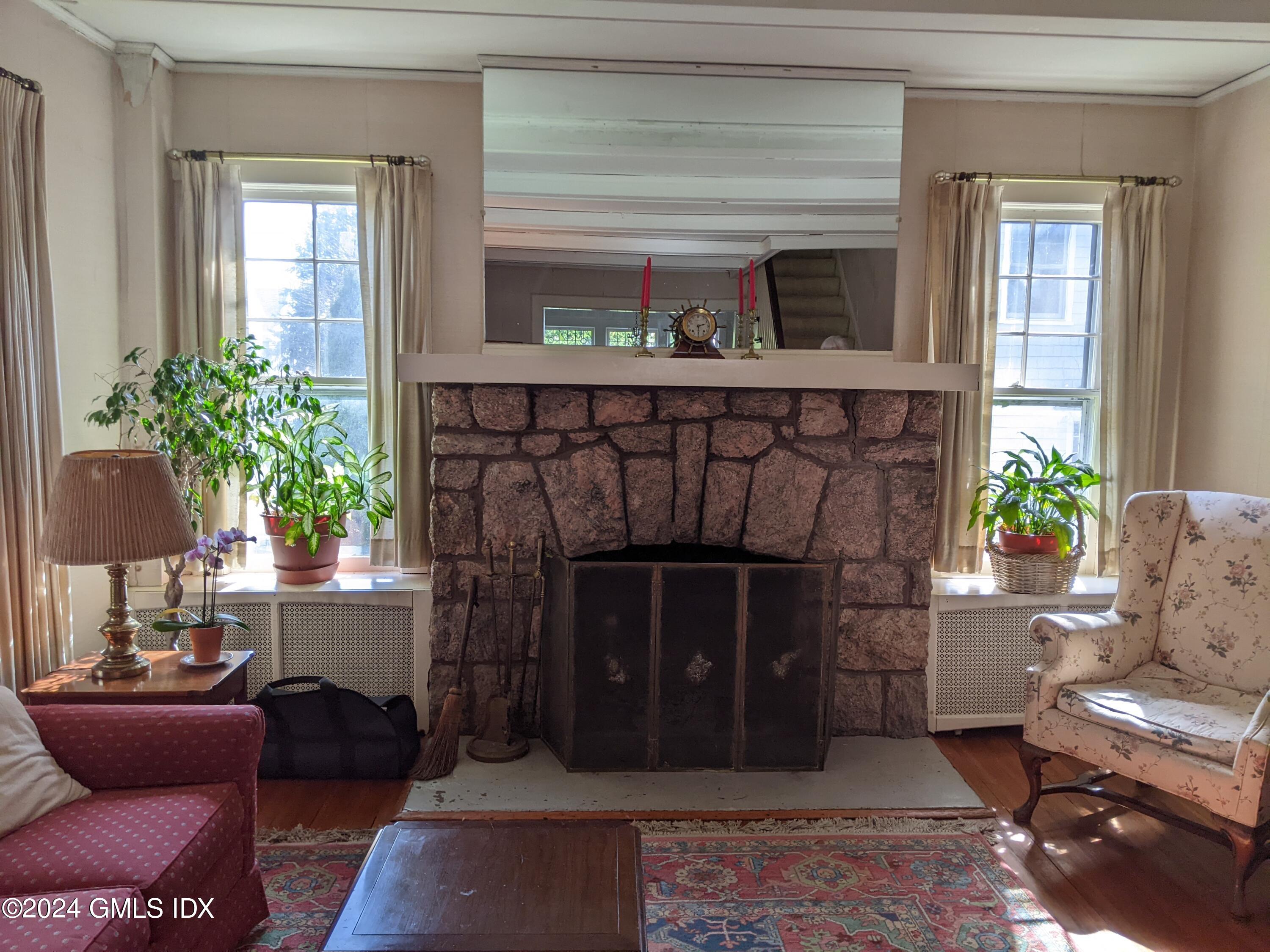 23 Ballwood Road Old Greenwich, CT 06870 - Photo 8 of 27 a living room with furniture and a fireplace