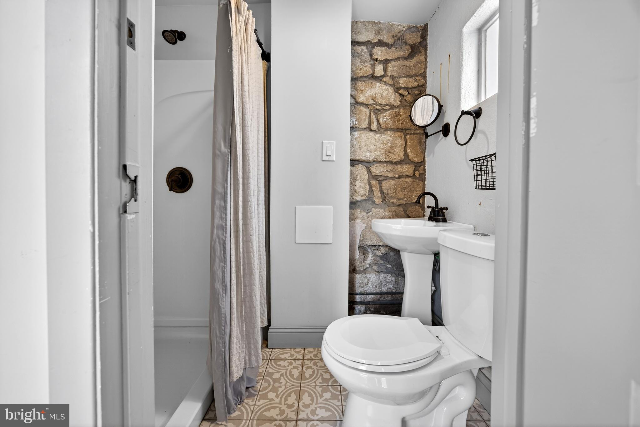 2389 Forest Grove Road Furlong, PA 18925 - Photo 12 of 20 a bathroom with a sink and toilet