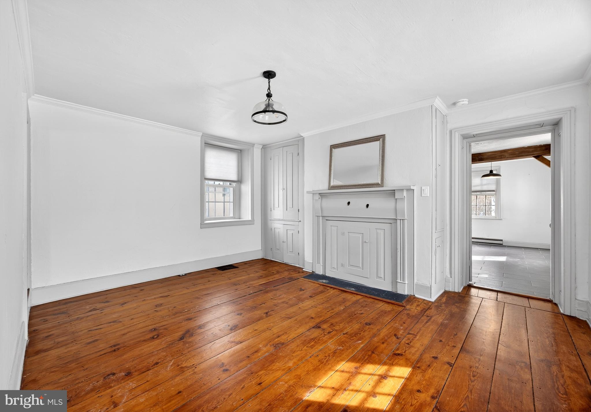 2389 Forest Grove Road Furlong, PA 18925 - Photo 3 of 20 a view of empty room with wooden floor and window