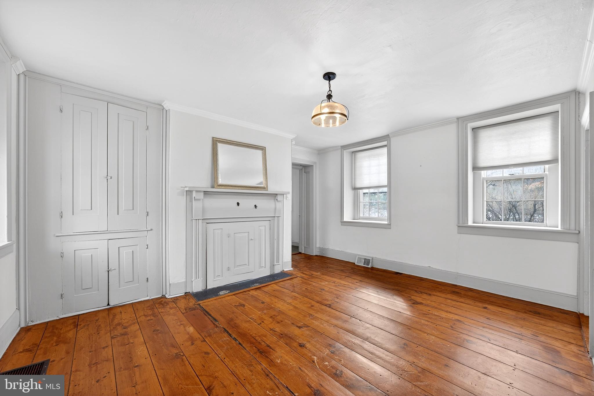 2389 Forest Grove Road Furlong, PA 18925 - Photo 5 of 20 a bedroom with a bed and a window