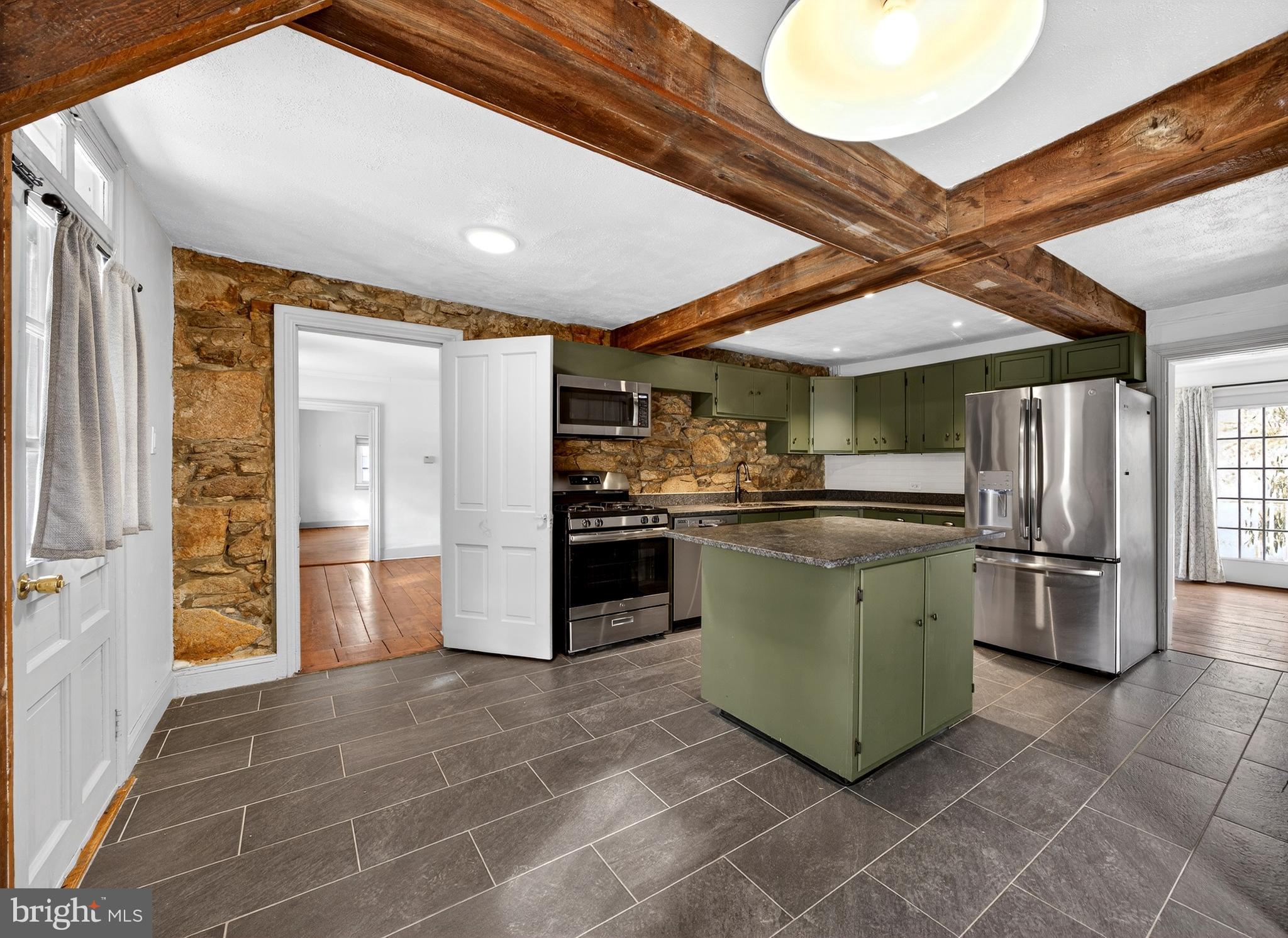2389 Forest Grove Road Furlong, PA 18925 - Photo 9 of 20 a kitchen with a refrigerator and countertop