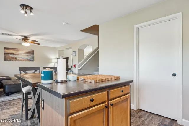 a view of a kitchen area with furniture and a chandelier