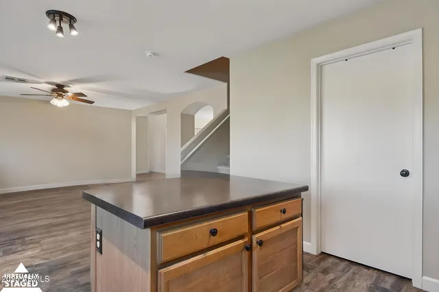 a work room with furniture and a window