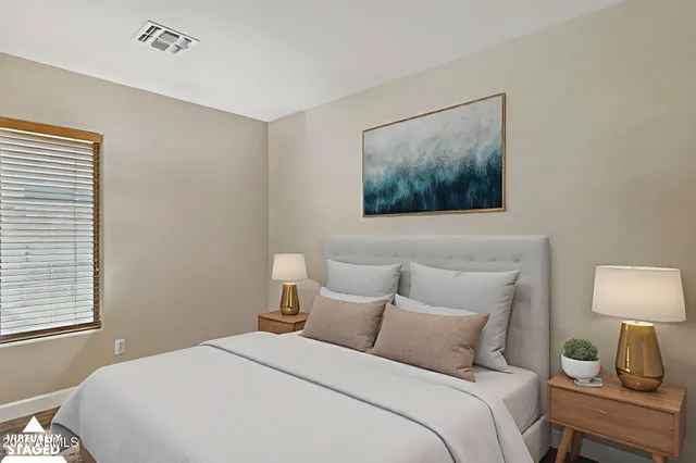 a view of a workspace with furniture and wooden floor