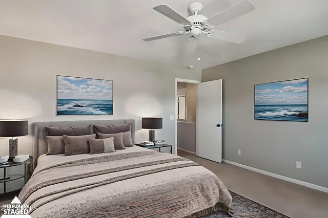 a bedroom with bed and a window