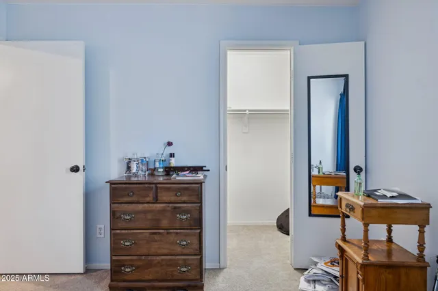 a bathroom with a double vanity sink toilet and a mirror