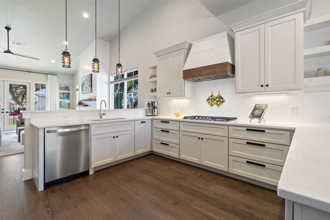 a kitchen with white cabinets and white appliances