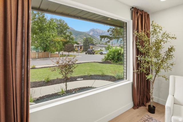 8760 Rustler Road Cottonwood Heights, UT 84093 - Photo 7 of 57 Expansive picture window showcasing mountain scenery and streetscape