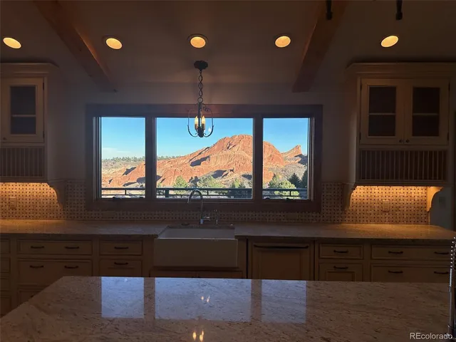 a view of a room with furniture and window