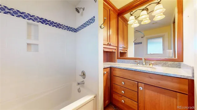 a spacious bathroom with a granite countertop sink mirror and