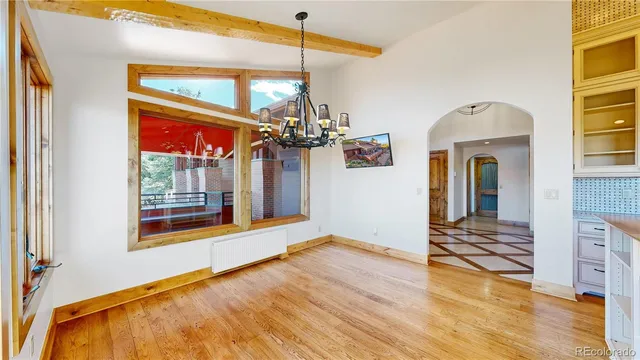 a view of front door of house and dining room