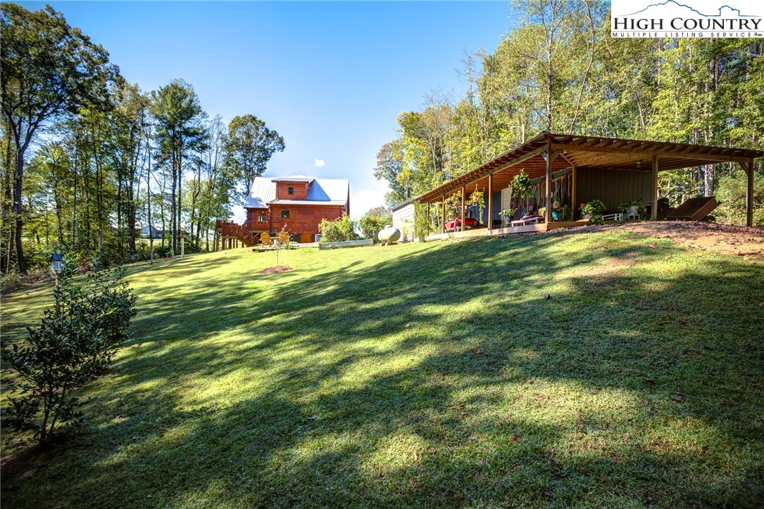 3460 South Center Church Road Thurmond, NC 28683 - Photo 47 of 50 a front view of a house with a garden