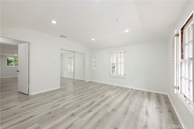 a bathroom with a shower sink and mirror