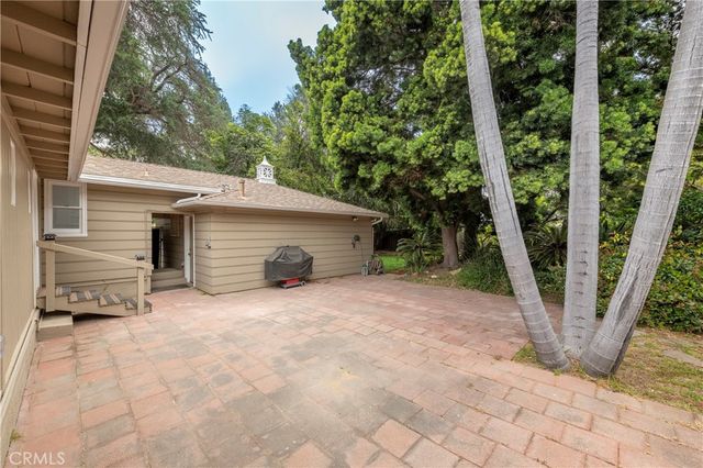 a view of a park with large trees