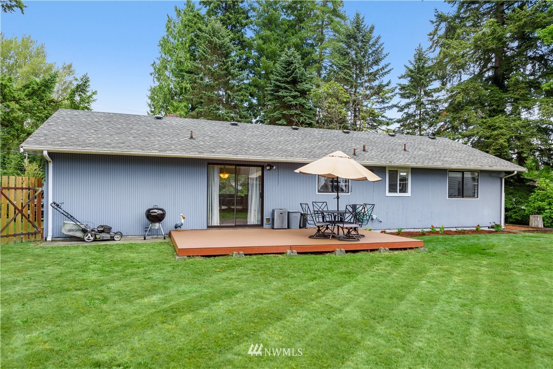 19910 Filbert Drive Bothell, WA 98012 - Photo 14 of 16 a view of a house with backyard and sitting area