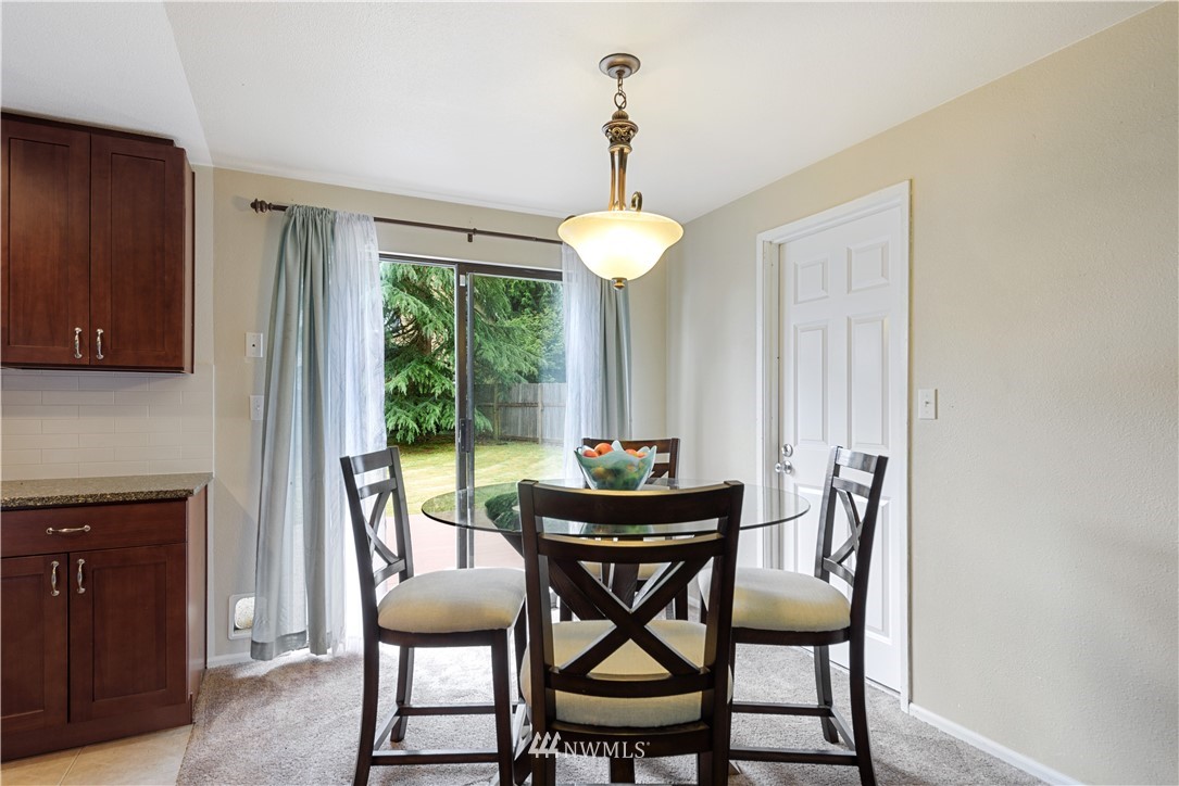 19910 Filbert Drive Bothell, WA 98012 - Photo 8 of 16 a dining room with furniture and window