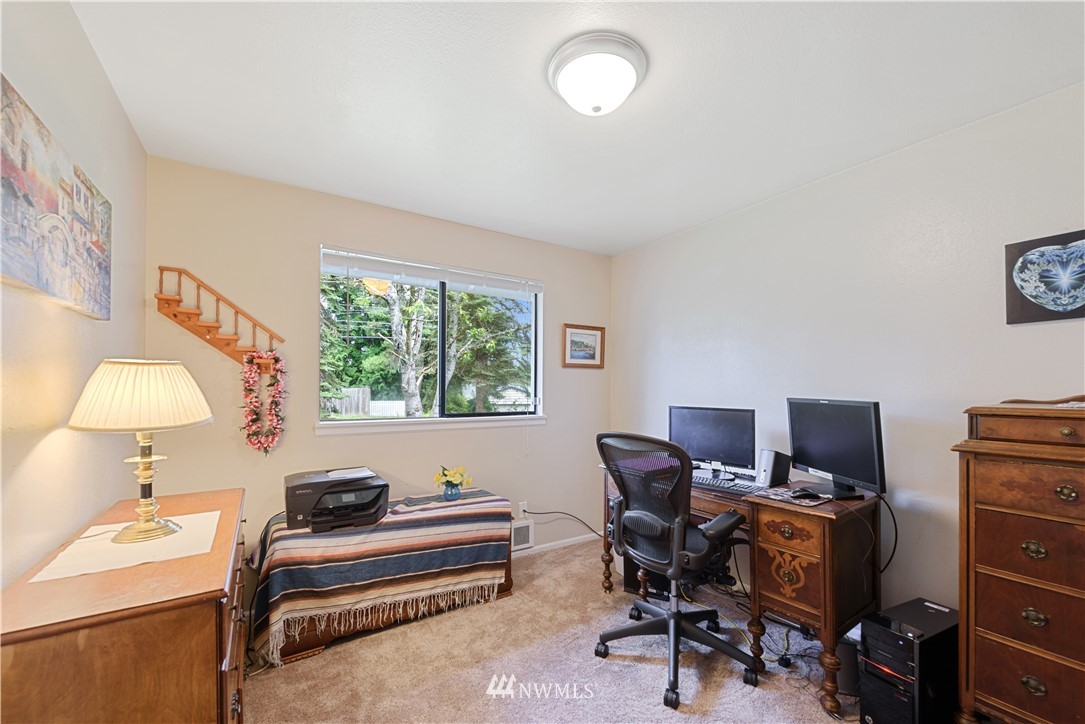 19910 Filbert Drive Bothell, WA 98012 - Photo 9 of 16 a living room with furniture and a window
