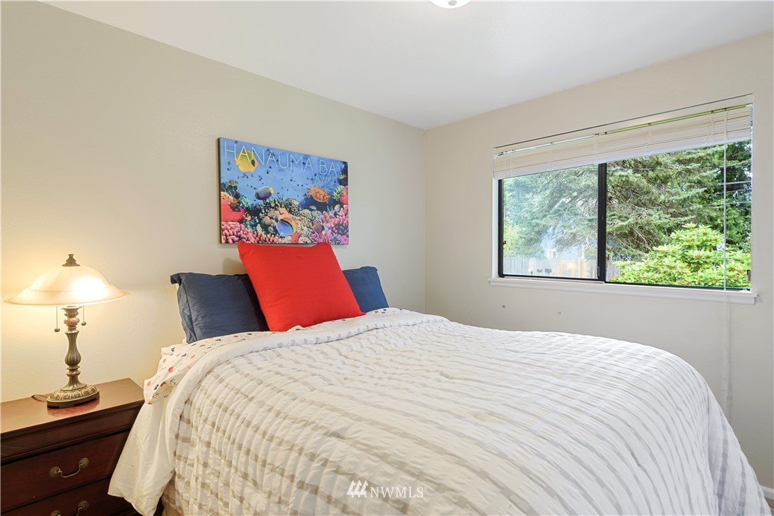 19910 Filbert Drive Bothell, WA 98012 - Photo 10 of 16 a bedroom with a bed and a window