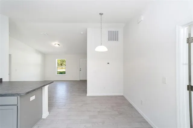 a view of a kitchen cabinets and a window
